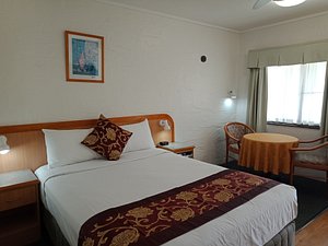 Espana Motel in Grafton, image may contain: Furniture, Bed, Bedroom, Chair