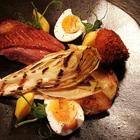 Pan-fried Duck Breast, Charred Chicory,
Crispy Hens Egg, Duck Croquette
served with Gratin Dauphinoise, Beetroot and Red wine jus.