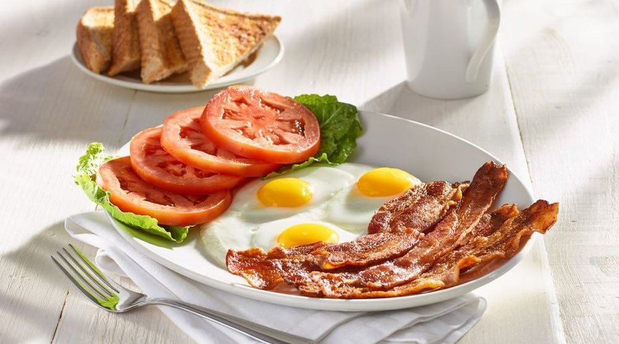 5 strips of premium bacon, three eggs, and freshly sliced tomatoes served with thick toast. 