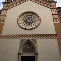 simple gabled façade with rose window