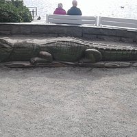 Statue of a crocodile by the lake in Kiellandshagen, Stavanger
