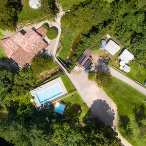 Areal image of grotto, reception and swimming pools