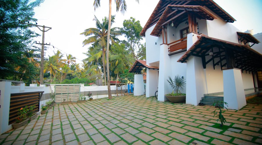 Exterior front view of The Ayur Villa in traditional Kerala architecture style building   