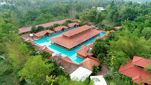SAJ Earth Resort & Convention Center in Nedumbassery, image may contain: Resort, Hotel, Building, Pool