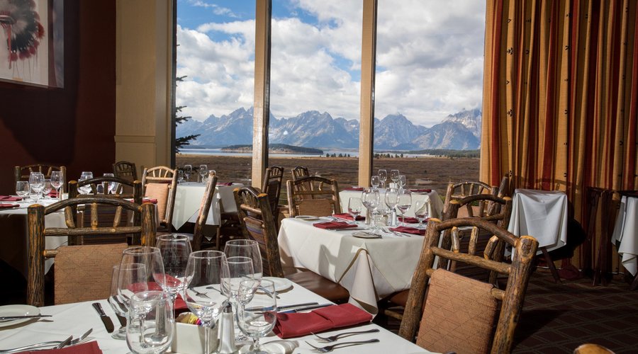 Every table has a panoramic view of the Teton Range and Jackson Lake.