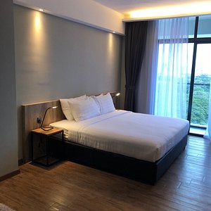 Tropics Eight Suites in Penang Island, image may contain: Bed, Furniture, Interior Design, Bedroom