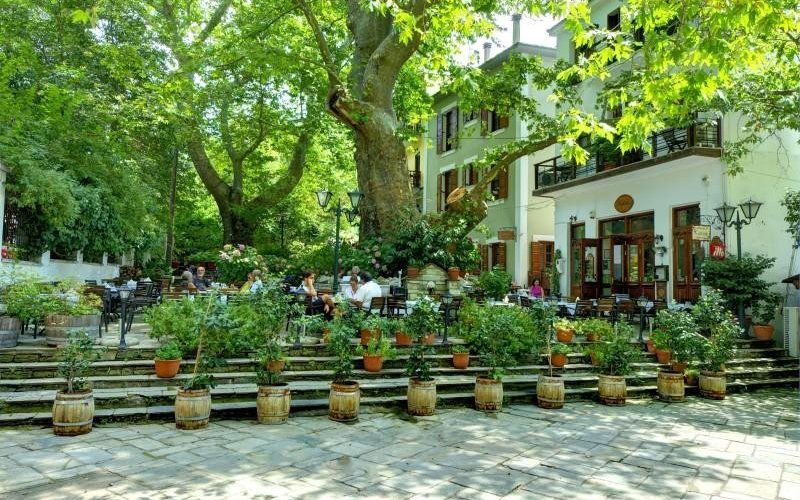 The beautiful yard of our restaurant In the central square of Portaria