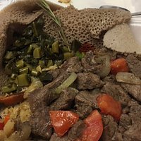 Half-eaten but this is beef tibs with cabbage and collards goman