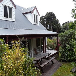 Small, secluded back porch at Rakiura Lodge