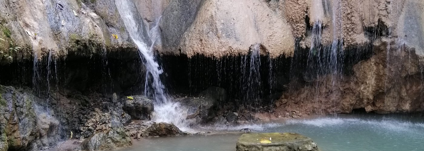 The waterfall just outside the cave entrance steps.