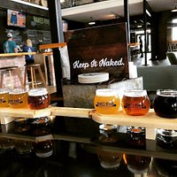 Try a flight served in a paddleboard! How original!