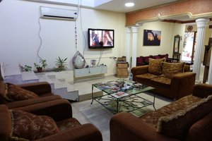 My Home Hotel - Petra in Petra - Wadi Musa, image may contain: Living Room, Couch, Home Decor, Screen
