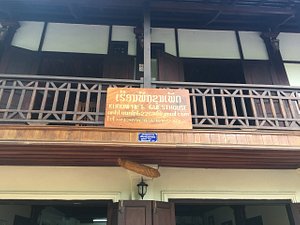 Khoun Phet Guesthouse in Luang Prabang, image may contain: Villa, Housing, Lamp, Plaque