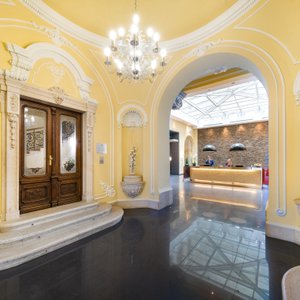 Hotel Palazzo Zichy in Budapest, image may contain: Living Room, Couch, Home Decor, Lighting