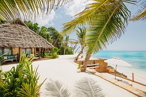 Tulia Zanzibar Unique Beach Resort in Zanzibar Island, image may contain: Hotel, Resort, Summer, Villa