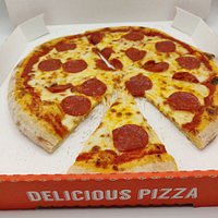 Serving fresh, hand rolled pizza with 100% mozzarella cheese