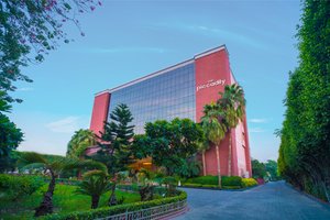 The Piccadily in Lucknow, image may contain: Office Building, Tree, Hotel, City