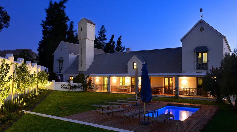 Uplighting in the garden provides a romantic backdrop to a stunning venue