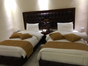Sharah Mountains Hotel in Petra - Wadi Musa, image may contain: Cushion, Home Decor, Hotel, Furniture