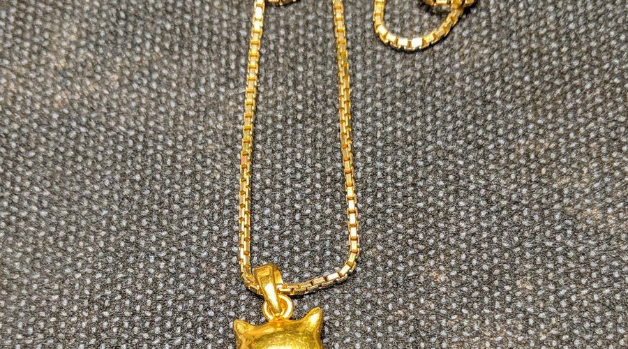 My beautiful, hand-made, 22k gold cat pendant!