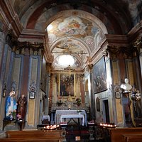 Another view of the interior of San Rocco showing paintings to the side of the altar