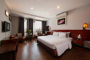 Sen Hotel in Hanoi, image may contain: Hotel, Resort, Bed, Home Decor