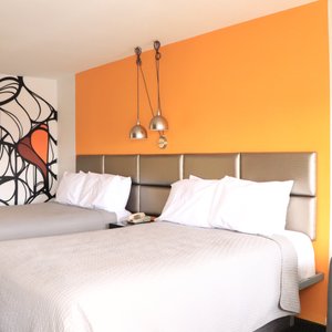 University Inn Tucson in Tucson, image may contain: Furniture, Interior Design, Dorm Room, Bedroom