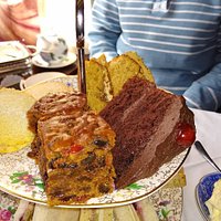 Winter Afternoon Tea. Turkey, cranberry and stuffing sandwiches (we requested no butter), mince pie & cream, fruitcake, and cake 😁