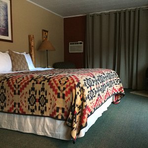 All guest rooms with king size beds and electric fireplaces are upstairs at the inn and have private baths with tub/shower. All guest rooms feature new El Paso Saddleblanket Company bedspreads as of December 2018.