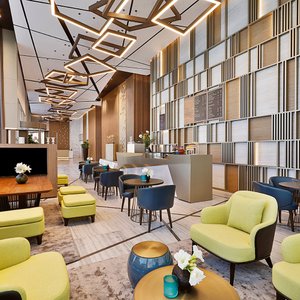 Enjoy a cup of coffee with friends or colleagues at our vibrant lobby café- Starbuzz Lounge