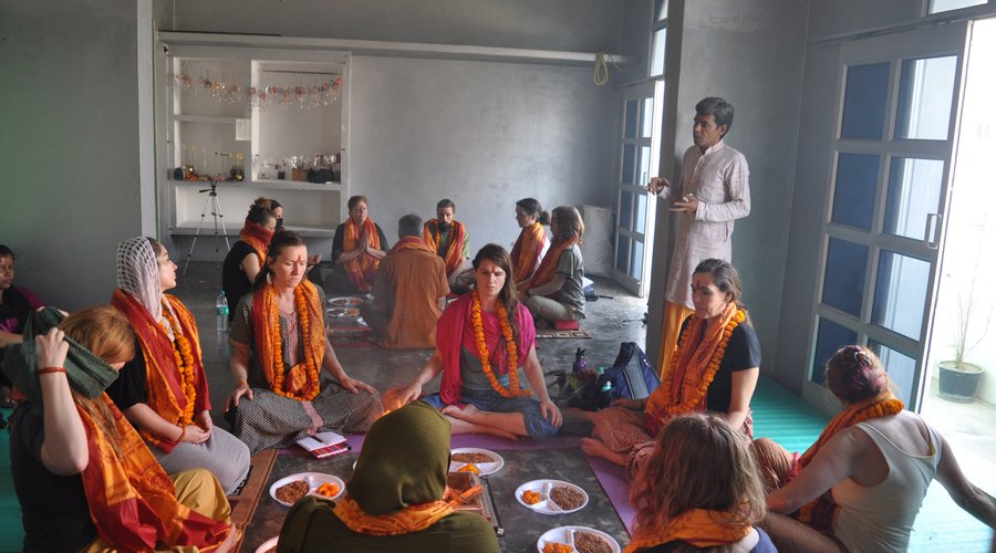 Umesh leading a fire ceremony at his home with a group of holistic health students from California.