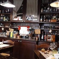 Part of the dining room with wine shelves