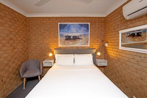 Coast Inn Motel in Ballina, image may contain: Lighting, Chair, Furniture, Bed
