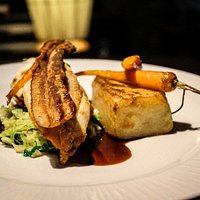 Pan Seared Chicken Supreme, buttered savoy cabbage, smoked bacon crisp, maple glazed carrot, pomme fondant, chicken jus