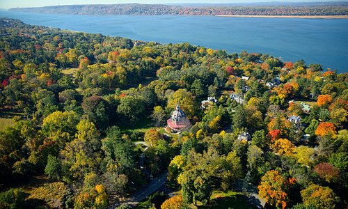 Aerial view of The Armour-Stiner Octagon House with Hudson River in background