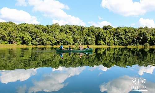 Canoeing through perfectly calm waters in this stunning lagoon beside Cobá.