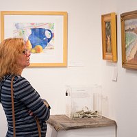 A visitor enjoys a quiet moment in the gallery.