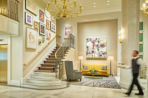 The Lancaster in Houston, image may contain: Staircase, Chandelier, Living Room, Foyer