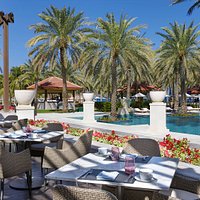 Al Khiran Kitchen offers a large deck to enjoy views over the infinity pool and the ocean.