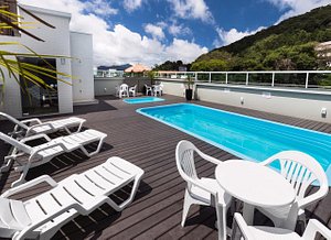 Hotel Rosenbrock in Balneario Camboriu, image may contain: Chair, Plant, Terrace, Pool