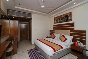 Hotel All Iz Well in New Delhi, image may contain: Corner, Interior Design, Chair, Bed