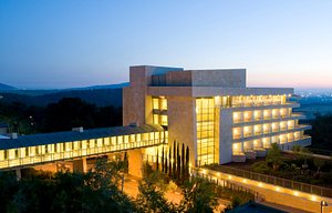 Kibbutz Lavi Hotel in Lavi, image may contain: Office Building, Convention Center, Condo, City