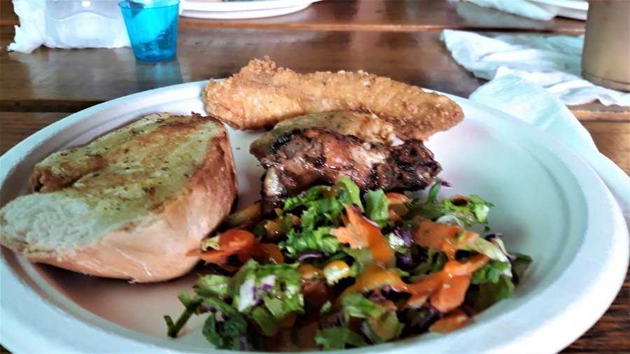 The lunch that was included in the excursion fee included:  Sorrell (to drink), and garlic bread, one large piece of fish, a salt cake (which is a second type of fish), a jerk chicken leg and green salad.  VERY tasty.