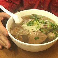 TAI NAM - Beef noodle soup with rare sliced steak, flank, and meatballs.