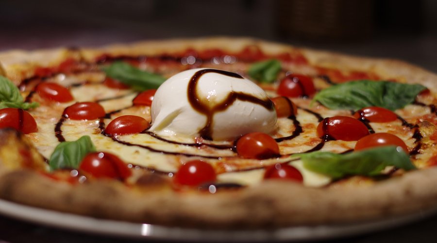 One of our most famous pizzas iz pizza Trulli with fresh burrata cheese and aceto balsamico