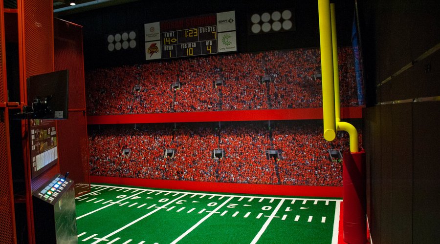 Get in the game and experience the sounds of a real football game in the First and Ten Line exhibit, inspired by the work of several NIHF Inductees. 