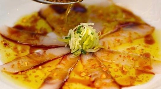An original of The Tuna & The Crab, our Olive Oil & Soy Sauce Sashimi sees sizzling olive oil and garlic poured over thin slices of fresh sea bream sashimi lightly cooking it to bring out a unique flavour!