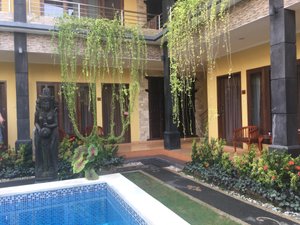 Wayan's House in Legian, image may contain: Villa, Hotel, Resort, Person