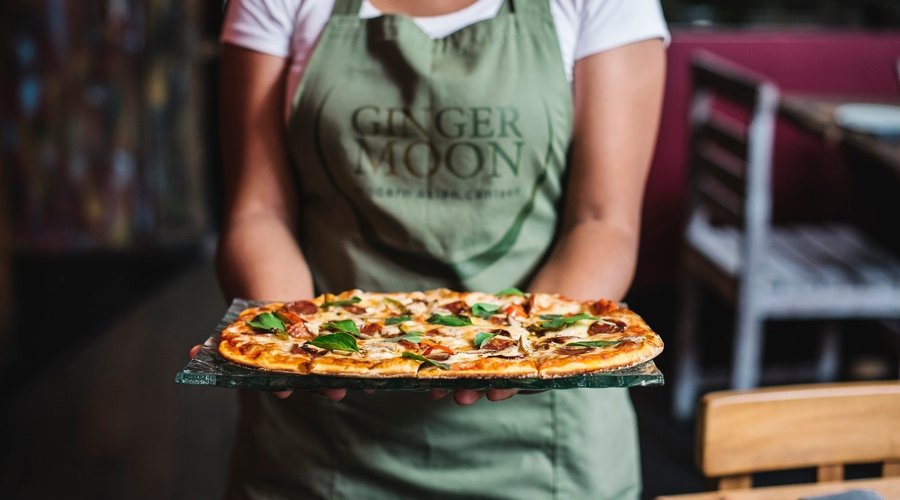 One of Ginger Moon Canteen's locally inspired pizza "they are thin, crispy & not round"!