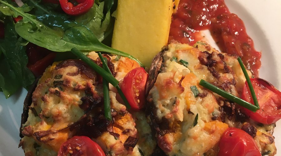 Vegetarian stuffed field mushrooms with polenta